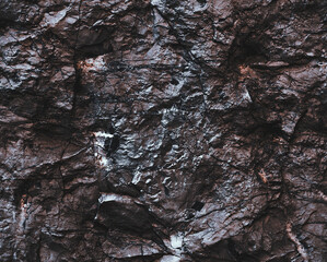 Wall marble. Brown texture. Stone background. Rock texture. Grunge Rough structure. Abstract texture. Rock surface with cracks. Rock pile. Paint spots wall.
