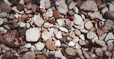 Brick brown. Rock pile. Rock background. Rock texture. Stone background. Paint spots. Rock surface with cracks. Grunge Rough structure. Abstract texture.