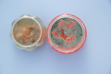 Two cans of spoiled slime. There's mold at the top