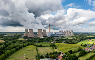 Aerial landscape view of a large coal fired power station with air pollution emissions