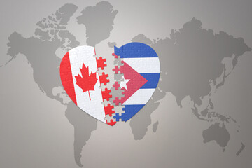 puzzle heart with the national flag of canada and cuba on a world map background.Concept.