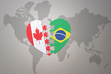 puzzle heart with the national flag of canada and brazil on a world map background.Concept.