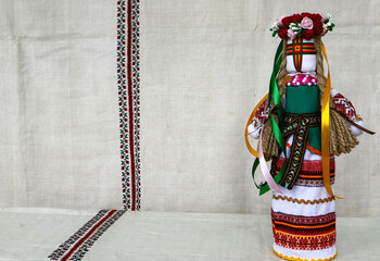 Traditional Ukrainian folk dolls motanka, handmade doll in folk costume, against the background of...