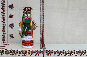 Traditional Ukrainian folk dolls motanka, handmade doll in folk costume, against the background of...