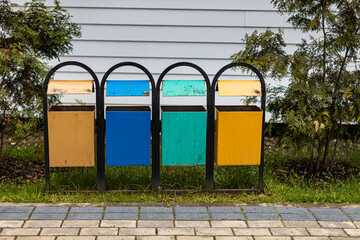 multi-colored metal urns with traces of rust