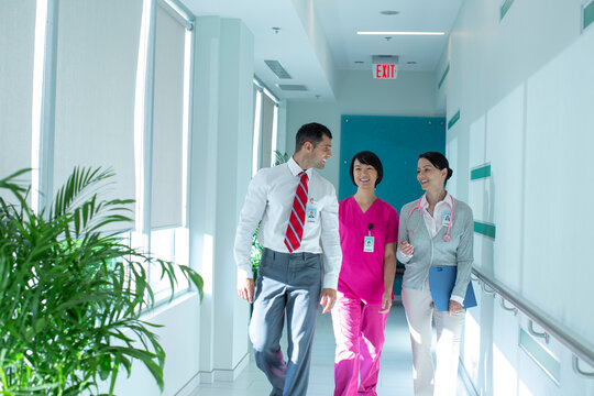 Three Health Care Professionals Talking To Each Other