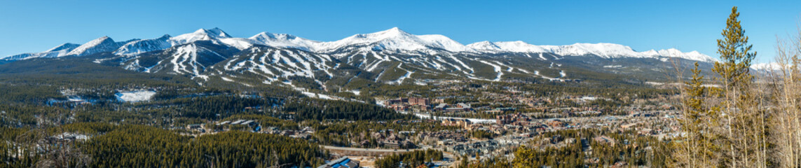 Panorama of Breckenridge, Colorado with ski trails on surrounding mountains - obrazy, fototapety, plakaty