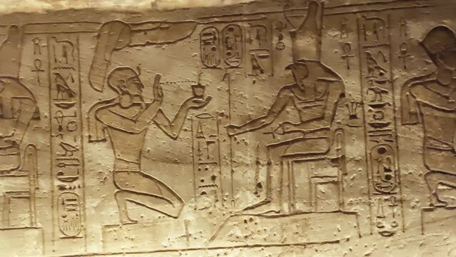 Wall paintings and hieroglyphs of the ancient Egyptian temple of Abu Simbel, a rock in Nubia, Egypt