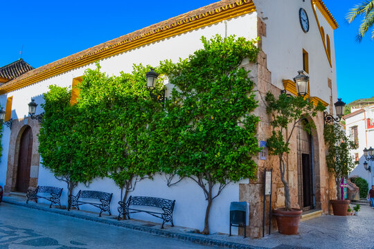 Ojen, Spain, 28.05.2022: The church of Our Lady of the Incarnation of the village of Ojen Malaga is located in the main square, the Plaza de Andalucia, on the corner of Calle Ojen. 
