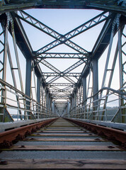 An old abandoned railway bridge during the sunset