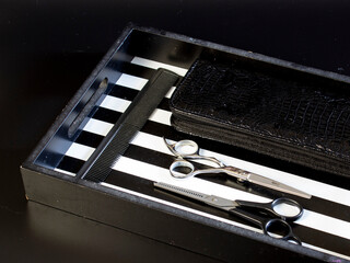 
hairdressing tool on a black background, strong plan