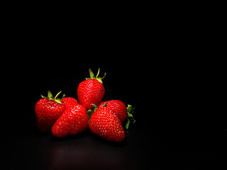 Strawberries on a black background. Isolate on black