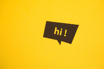 Hello speech bubble on the yellow background.