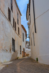 Ronda, Spain, 25.05.2022: Ronda Old Town Casco Antiguo. Old town with its white architecture, narrow streets, white buildings, balconies.