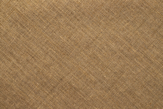 light brown burlap fabric texture. natural grunge background