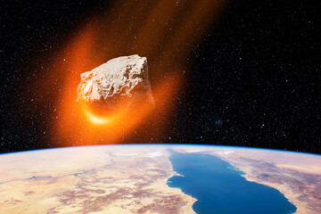 Planet Earth and big asteroid in the space. Potentially hazardous asteroids (PHAs). Asteroid in...