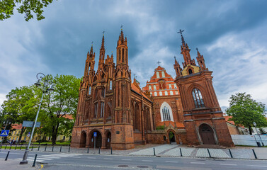 Vilnius, Lithuania. Roman Catholic Church Of St. Anne And Church Of St. Francis And St. Bernard In Old Town In Summer Sunny Day. UNESCO World Heritage