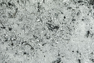 Gray ash from the oven background texture, cinder, grey ashes from the wood from the fireplace. Ashes texture, may use as a background
