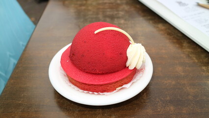 red hat shaped cake on a plate