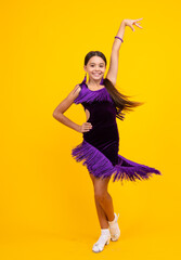 Ballroom teenager dancer isolated on studio yellow background. Latin classic dance. Rumba, samba...