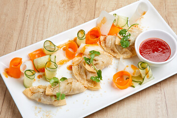 Closeup of fried spring rolls with carrot