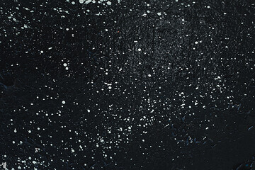 Grunge Rough structure. Black texture. Stone background. Dark marble. Rock texture. Rock surface with cracks. Rock pile. Paint spots wall. Abstract texture.