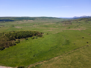 Fototapeta premium Aerial view of rural land near town of Godech, Bulgaria