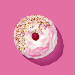 pink donut with glaze on pink pastel background