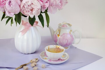 Greeting card with a bouquet of pinks beautiful huge peonies