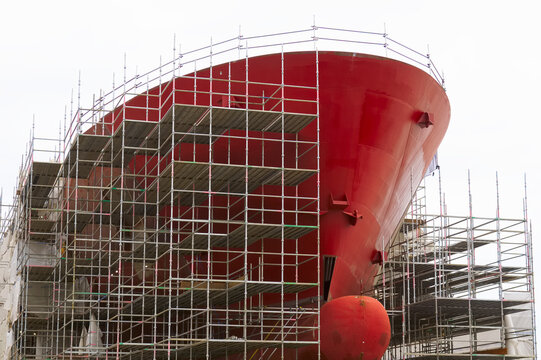 Shipbuilding and crane during ferry construction surrounded by scaffold