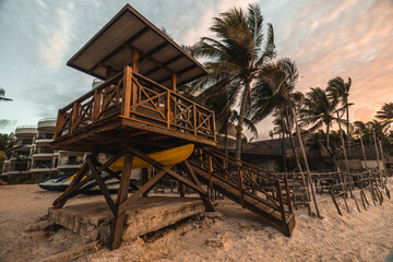 wooden lifeguard box on the beach at sunrise in the caribbean