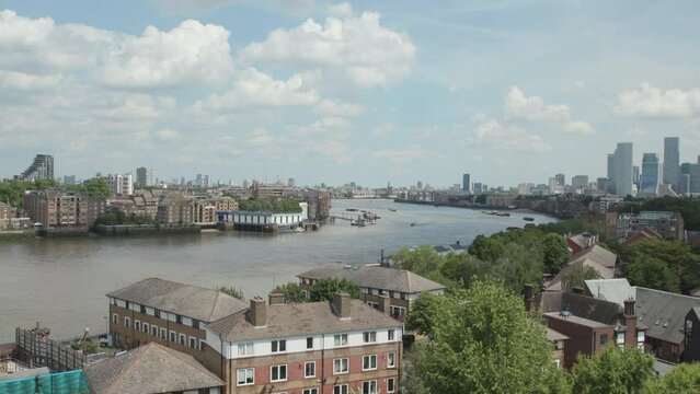 River Thames in London - with views of boats and Canary Wharf, Bermondsey, Rotherhithe, Wapping