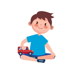 little boy playing with car