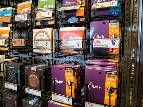 Lynnwood, WA USA - circa May 2022: Angled view of guitar strings for sale inside a Guitar Center musical instrument store.