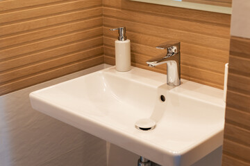 Sink with chrome faucet in a modern minimalist interior