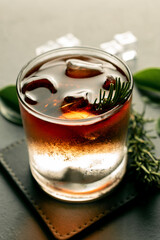 whiskey with mineral water and rosemary