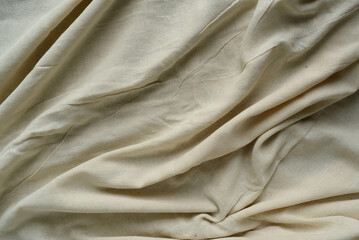The cloth beige color background texture.