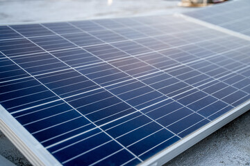 Solar panels located on the roof of the block. Green energy in modern city.