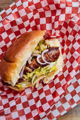 Top view of a hot dog in a takeout container