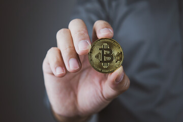 Businessman holding Bitcoin close up, concept of stock and business investment, business stock.