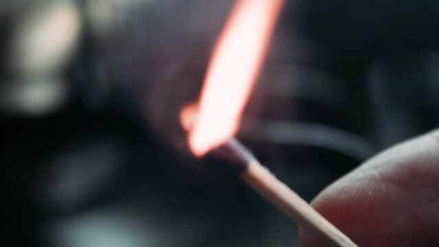 close up of a hand holding a fire