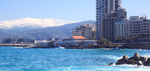 Naklejka premium Panoramic view of the Beirut skyline with snow-covered Mt Sannine in the background