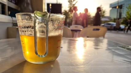 A cold beer on the way home from work at sunset