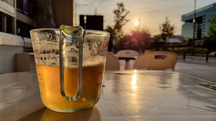 A cold beer on the way home from work at sunset
