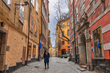 Stockholm Sweden, city skyline at Gamla Stan old town with woman tourist