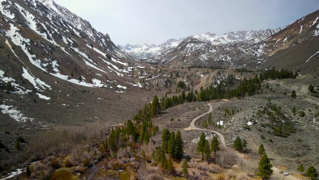 Scenic landscape of snow capped Eastern Sierra mountains in springtime near Aspendell.