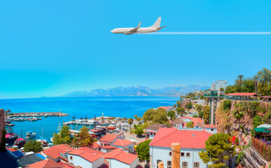Fototapeta premium White an air plane fly over the Old Town Kaleici - Antalya, Turkey