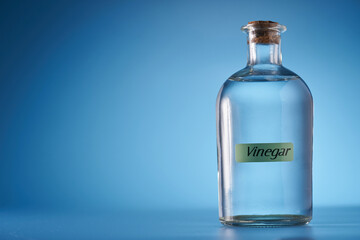 white vinegar against blue background