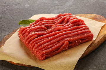 Raw beef minced meat over board