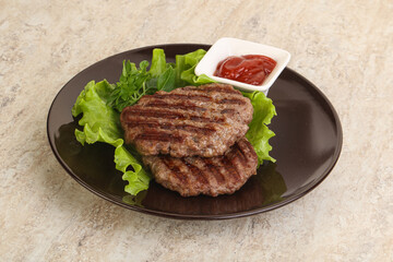 Grilled beef burger cutlet with sauce